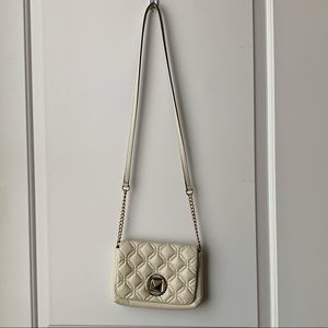 Cream colored Kate spade cross body bag